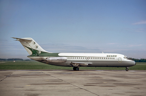 Cedar Rapids, Iowa, USA - 1989: McDonnell Douglas DC-9 jet airplane in Ozark Air Lines livery taxiing.