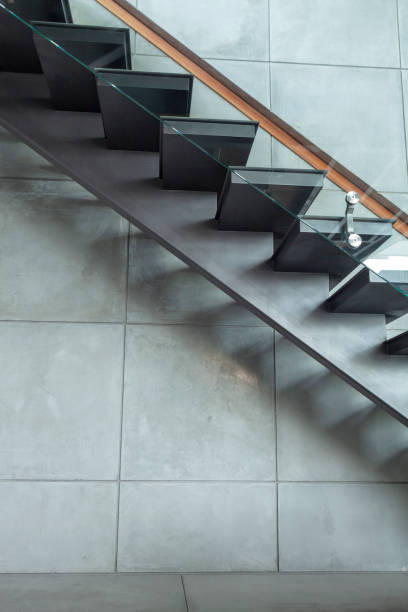 istock staircase in modern villa and cement wall background 1092500896