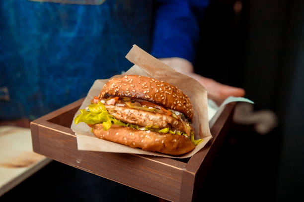 istock fresh tasty burger on black background 1092506426