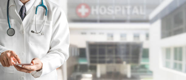 istock Male doctor using mobile phone at hospital. 1092507102