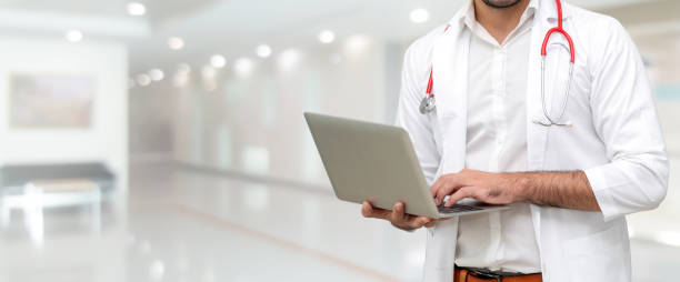 istock Doctor using laptop computer at the hospital. 1092510200