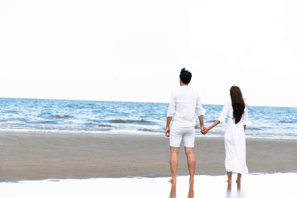 istock Couple going honeymoon on tropical beach in summer 1092510394