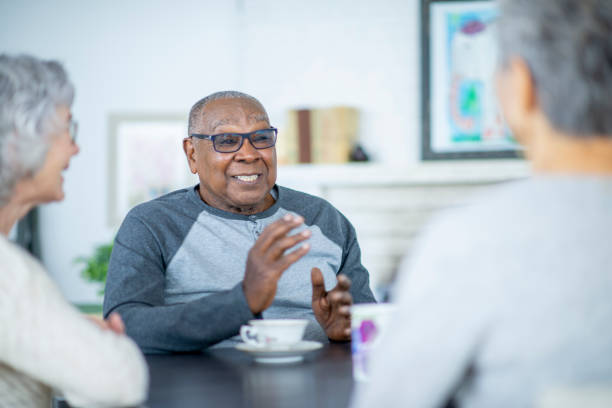 istock Senior man speaking with friends 1092510444