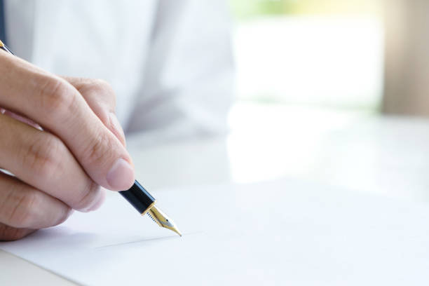 istock Hand man woman on paper with marry ring 1092510898