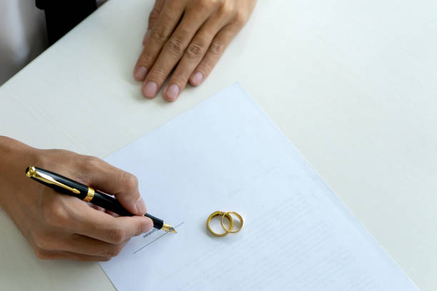 istock Hand man woman on paper with marry ring 1092510908