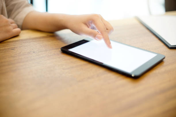 istock business people use tablet on the table 1092510912