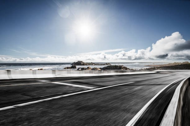 istock tarmac road by sea against clear sky 1092521736