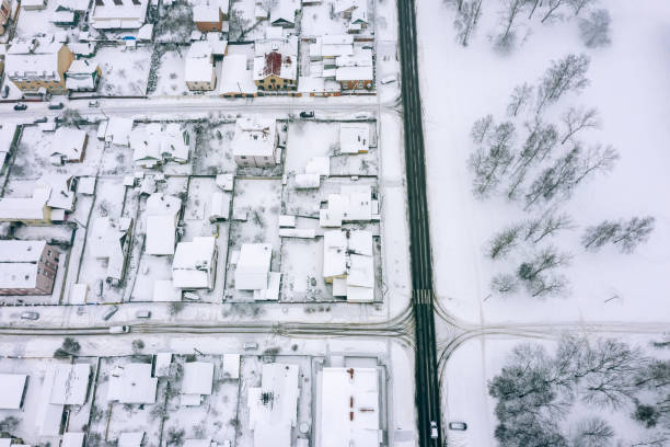 istock suburb residential area covered with snow. birds eye view 1092525126