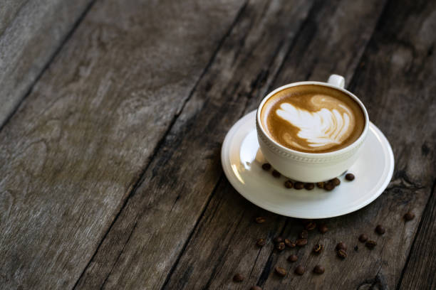 istock Cup of coffee with dessert on a wooden table 1092526636