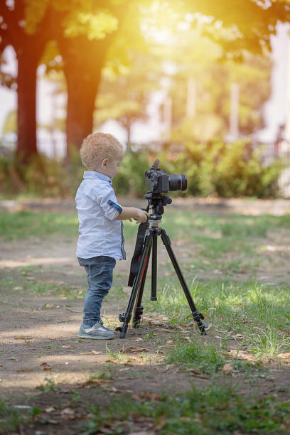 istock A two years old boy is photographer. 1092530030