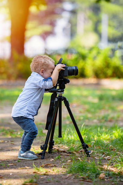 istock A two years old boy is photographer. 1092530562
