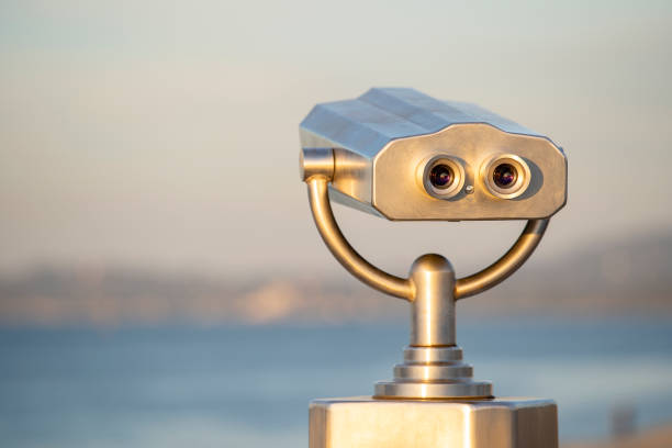 istock Public binocular on sea shore, close up. Coin operated binocular viewer on blurred background of sunset and sea 1092540264