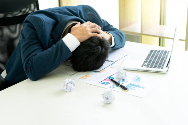 istock businessman sit at the table fill sad and headache 1092543864