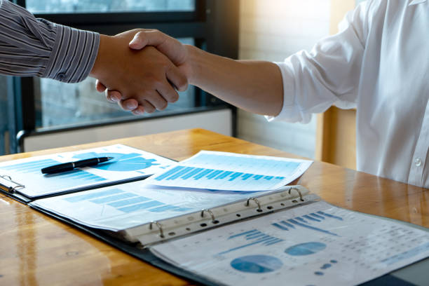 istock Businessman hand together Handshake for business 1092543994