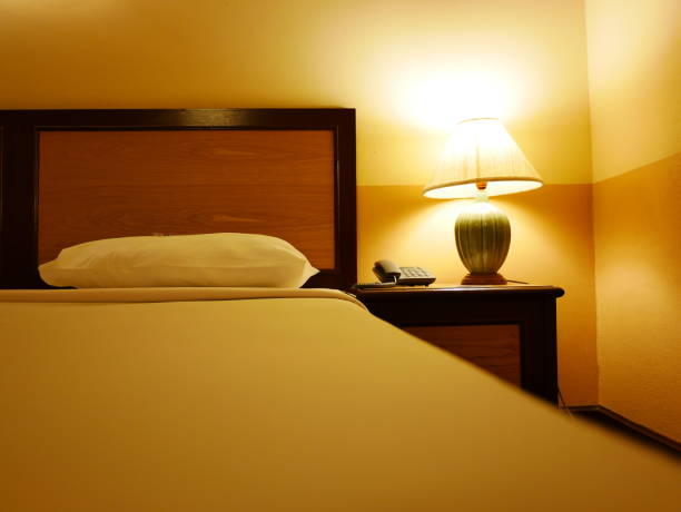 istock Electric lamp and book on bedside 1092556296