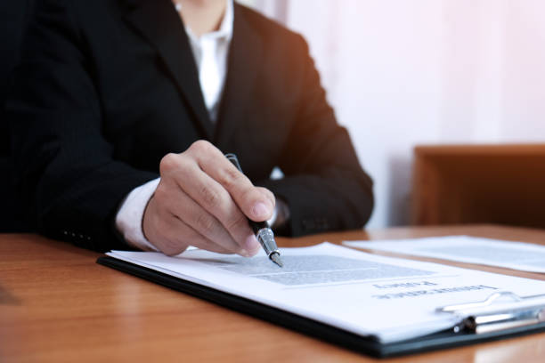 istock Sales manager giving advice application form document, considering mortgage loan offer for car and house insurance. 1092560186