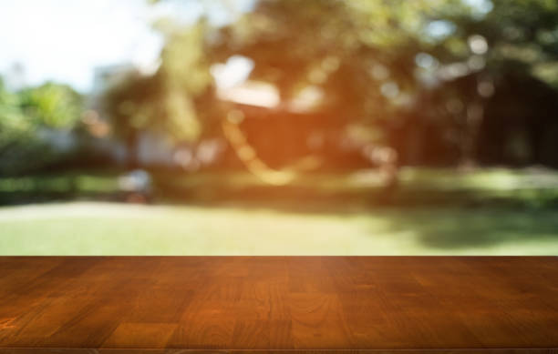 istock Empty dark wooden table in front of abstract blurred bokeh background of restaurant . can be used for display or montage your products.Mock up for space. 1092560310