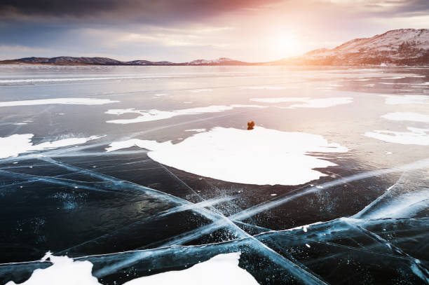istock Cracked ice on the frozen lake. 1092560912