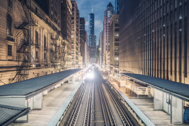 istock Subway train rounding corner on elevated tracks in downtown Chicago 1092561612