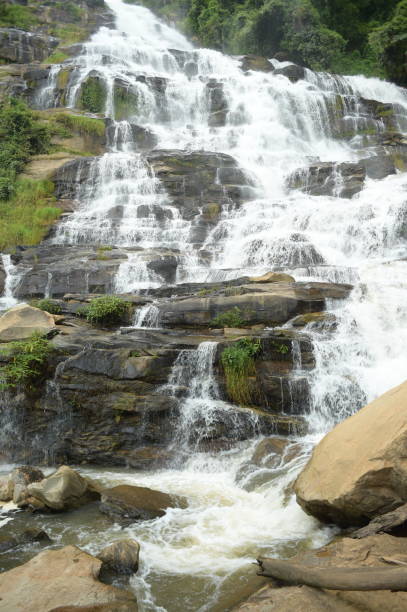 istock Beautiful waterfall with stones in forest 1092570038