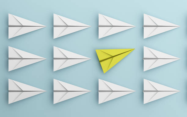istock leadership or different concept with yellow and white paper airplane on blue background. Digital craft in education or travel concept. Mock up design. 3d abstract illustration 1092581410