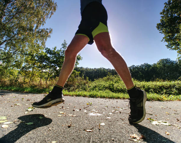 istock The man run in the forest. The Athletic man running 1092582214