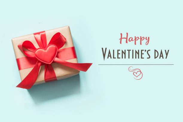 istock Valentine's card. Gift with heart on blue. Top view. 1092590192