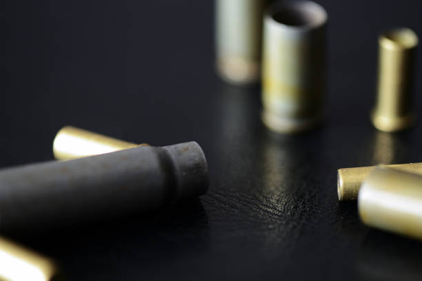 istock Empty old bullet cartridges on a dark background close up 1092593772