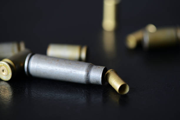 istock Empty old bullet cartridges on a dark background close up 1092593774