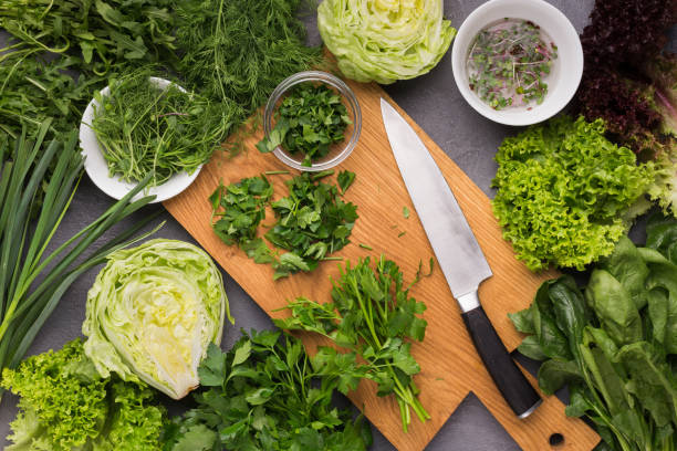 istock Cooking fresh detox salad on kitchen table 1092604858