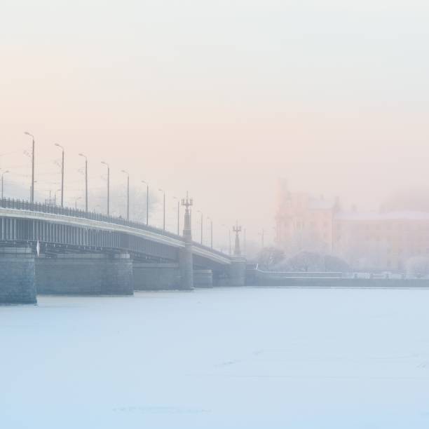 istock Riga cityscape with stone bridge in fog 1092606844