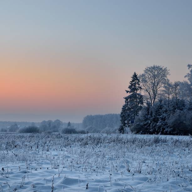 istock colorful winter sunset, countryside view 1092607054