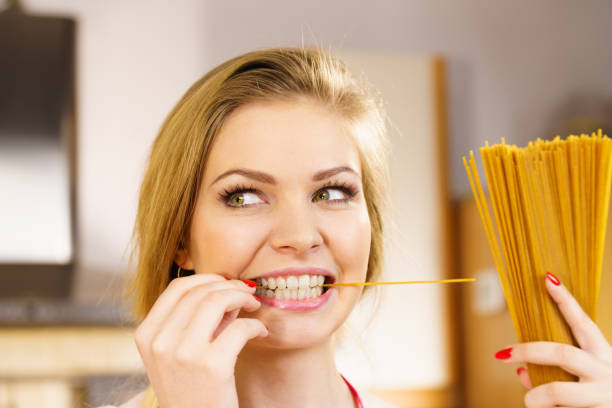 istock Woman holding long pasta 1092613872