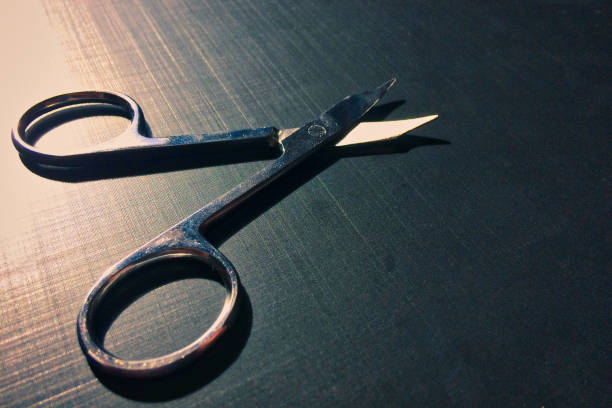 istock small nail scissors on a dark background, nail scissors, small scissors, dark background 1092620396
