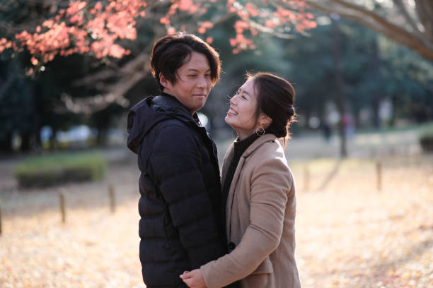 istock Couple embracing each other in Park 1092620800