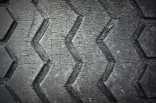 cracked surface of a weathered tyre, texture
