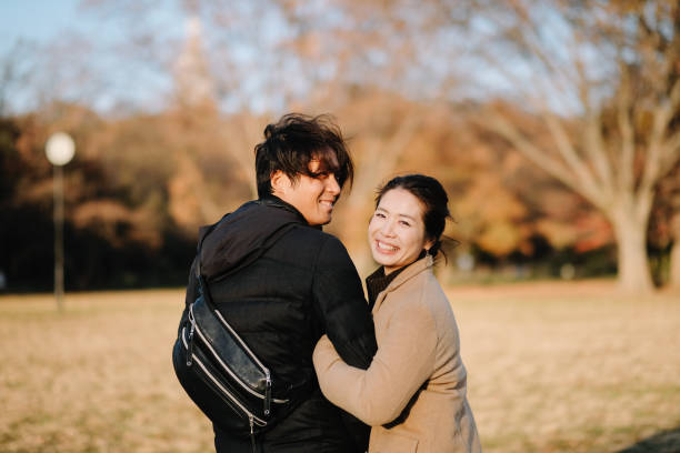istock Couple walking in Autumn park 1092622616