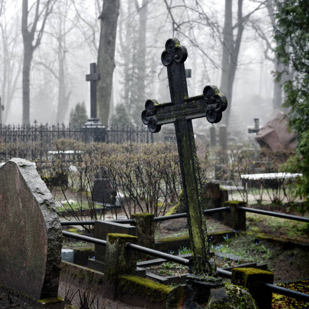 istock cross in fog at the cemetery 1092625852