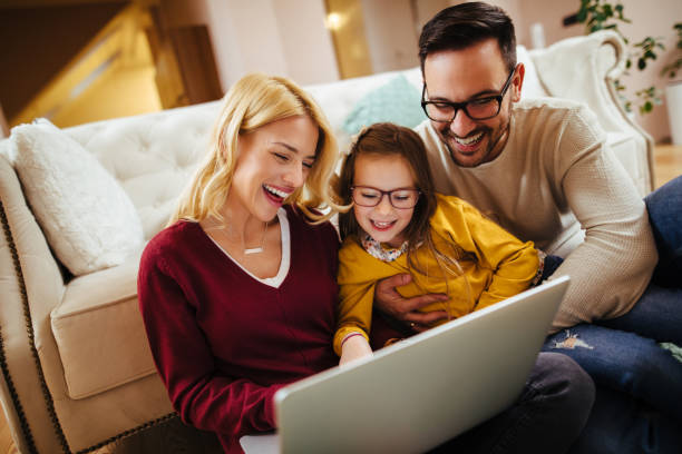 istock Family using laptop at home 1092633462