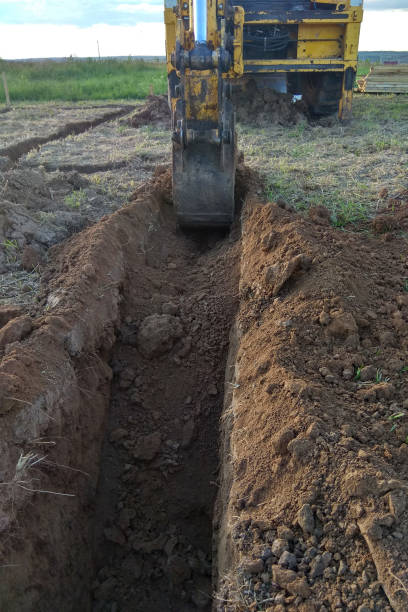 istock View from above at Working Excavator Tractor Digging A Trench. 1092635550