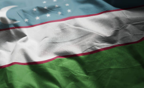 istock Uzbekistan Flag Rumpled Close Up 1092637042