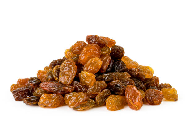 istock Heap of raisins closeup on a white. Isolated. 1092639930