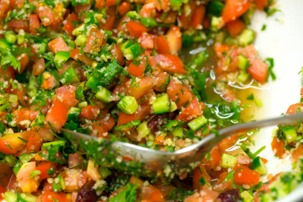 istock Tomato, avocado and red onion salad with olive oil. 1092641878