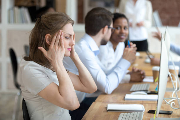 istock Tired businesswoman touching temples, feeling headache 1092645796