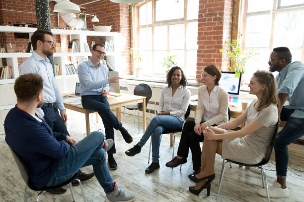 istock Happy coach laughing at employee joke at briefing 1092645870