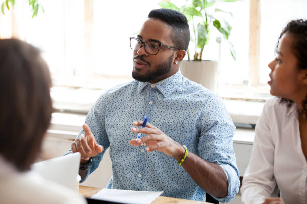 istock African American businessman speaking about ideas at briefing 1092646022