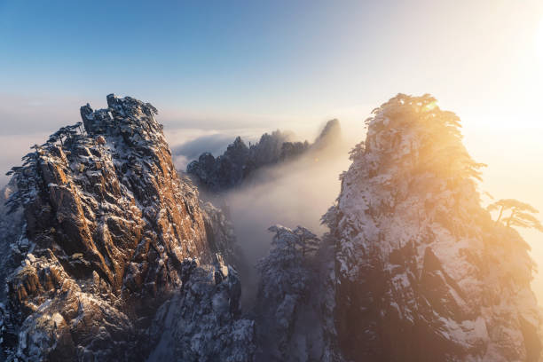 Winter sunrise landscape in Huangshan National park Frozen forest in Huangshan National park. huangshan mountains stock pictures, royalty-free photos & images