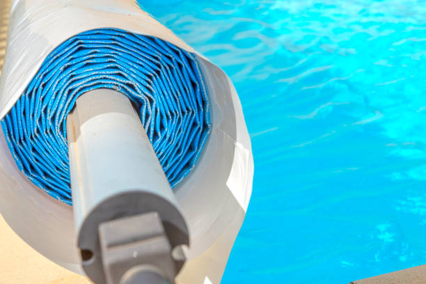 istock Pool cover on the edge of a pool during the summer 1092655314