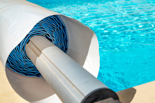 istock Pool cover on the edge of a pool during the summer 1092655342