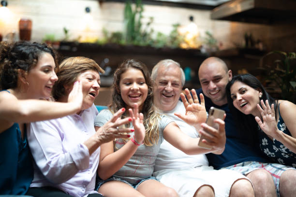 istock Multi-Generation hispanic-latino family having a video chat at home 1092663558